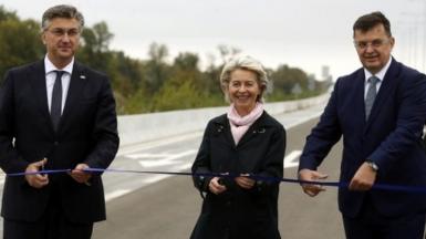 Ursula von der Leyen (C), Croatian Prime Minister Andrej Plenkovic (L) and Chairman of the Council of Ministers of Bosnia and Herzegovina, Zoran Tegletija (R) open a border crossing, a bridge over the Sava River between Croatia and Bosnia and Herzegovina
