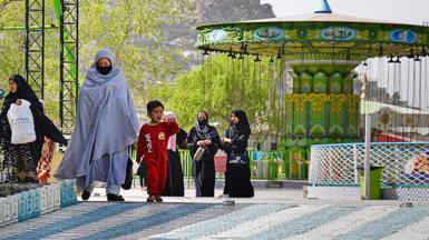 Afghan people visit an amusement park in Kabul on March 28, 2022