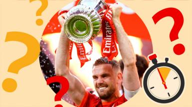 Jordan Henderson lifts the FA Cup for Liverpool