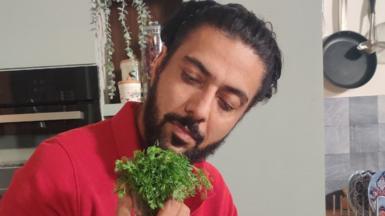 Chef Ranveer Brar with a bunch of coriander