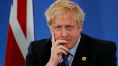 Boris Johnson hand on face