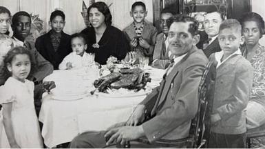 Walter seated surrounded by family