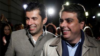 Kiril Petkov and Assen Vassilev, leaders of Bulgaria's new centrist party "We Continue the Change", react after the first exit polls during parliamentary and presidential elections on 14 November