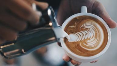 Athenkosi makes latte art