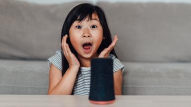 Stock photo of girl and voice assistant