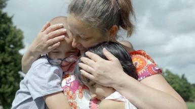 Olga reunited with two of her adopted children