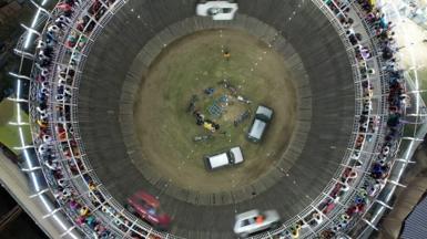 The well of death is a jaw-dropping show where drivers almost defy gravity to ride their bikes and cars inside a giant wooden barrel-like structure.