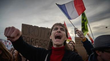 Protestors chant against the French Government during demonstrations at Place de la Concorde