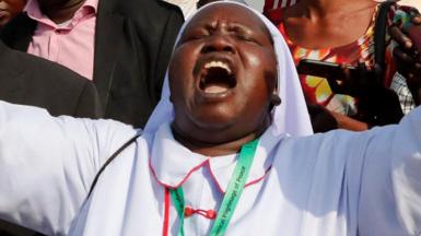 A South Sudanese nun reacts as she welcomes Pope Francis during his visit in Juba, South Sudan February 3, 2023
