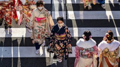 Young women wear kimonos to mark 