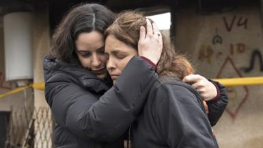 Amit Soussana (r), who was held hostage by Hamas and released hugs a friend near her house where she was kidnapped during the 7 Oct attack on the kibbutz, on 29 January 2024 in Kfar Aza, Israel.