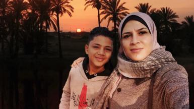 Nashwa and son in front of al-Zahra backdrop