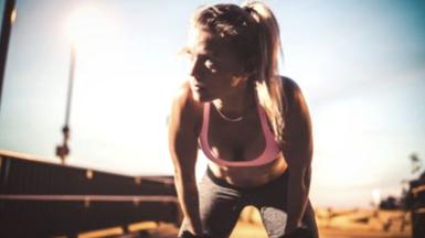 Female runner pausing for breath