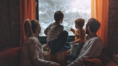 Family looking out window