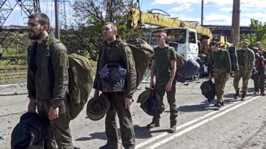 Ukrainian servicemen leave the Azovstal steel plant in Mariupol, Ukraine, 20 May 2022