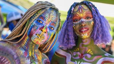 Participants show off artwork at the 9th annual NYC Body Painting Day in Union Square, New York City, US, on 24 July 2022