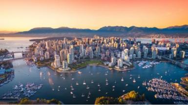 Aerial view of downtown Vancouver skyline at sunset