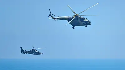Chinese military helicopters fly past Pingtan island, one of mainland China's closest point from Taiwan, in Fujian province on 4 August 2022