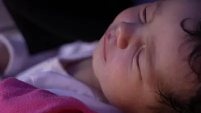 Close-up of Khadija's unnamed baby sleeping