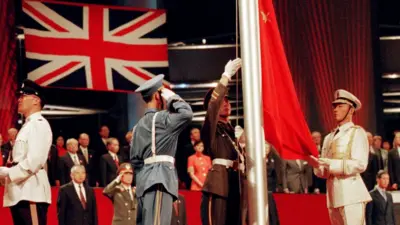 The Chinese flag is raised by People's Liberation Army (PLA) soldiers at the handover ceremony on 1 July 1, 1997