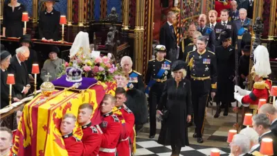 The coffin of Queen Elizabeth II is carried into Westminster Abbey