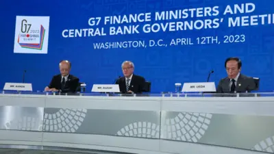 Japanese Finance Vice Minister Masato Kanda, Finance Minister Shunichi Suzuki and Bank of Japan Governor Kazuo Ueda speak during a news conference at the annual spring meetings of the World Bank Group and the International Monetary Fund (IMF) at the IMF headquarters on April 12, 2023 in Washington, DC.