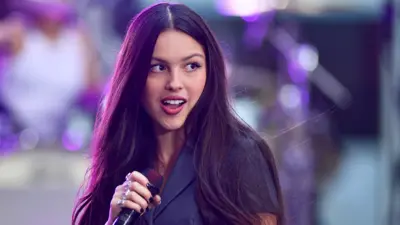 Olivia Rodrigo singing on stage