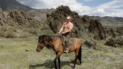 Russian Prime Minister Vladimir Putin rides a horse during his vacation outside the town of Kyzyl in Southern Siberia on August 3, 2009