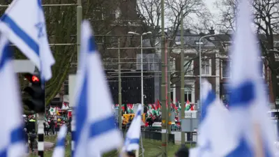 Pro-Israeli and pro-Palestinian protesters gather near the ICJ