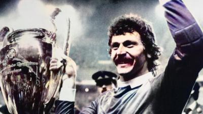 Steaua keeper Helmut Duckadam celebrates with the European Cup trophy in 1986