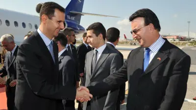 S﻿uriye Devlet Başkanı Beşar Esad ve Suriye'nin son Ankara Büyükelçisi Nidal Kabalan