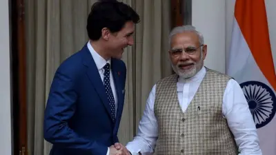 Canadian Prime Minister Justin Trudeau (L) and Indian Prime Minister Narendra Modi shake hands before a meeting at Hyderabad house in New Delhi on February 23, 2018.