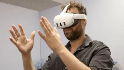 Man plays VR game in headset