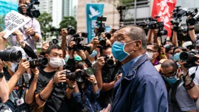 Hong Kong media tycoon and founder of Apple Daily newspaper Jimmy Lai arrives at the West Kowloon Magistrates' Court on May 18, 2020 in Hong Kong,