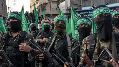 Вооруженные люди с зелеными повязками на голове