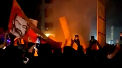 Protesters gather around fire