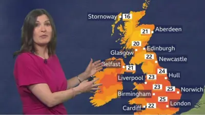 Helen Willets with a weather map