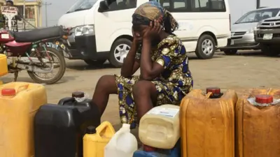 Woman look frustrated as she never fit buy fuel