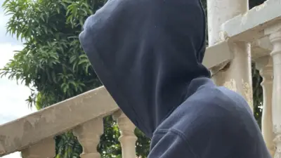 Man with a hood on