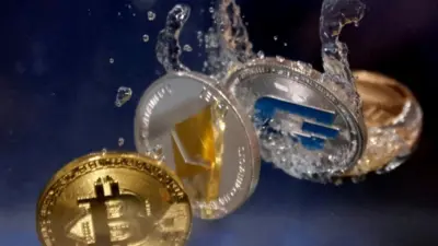 Representations of cryptocurrencies plunge into water in this illustration taken
