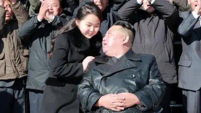 Kim Jong-un and his daughter with North Korean military personnel at a photo session