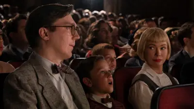 A still from the film showing The Fabelman family at the cinema