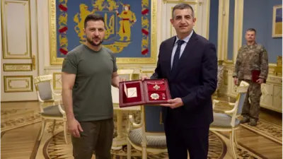 Ukraine's President Volodymyr Zelensky awards Haluk Bayraktar, CEO of Turkish drone maker Baykar Technology with the Order of Merit