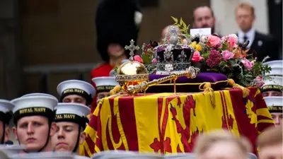 The coffin of Queen Elizabeth II is placed on a gun carriage during the State Funeral of Queen Elizabeth II at Westminster Abbey on September 19, 2022 in London, England.