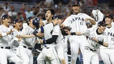 Japan's players celebrate winning the World Baseball Classic after their 3-2 win over the USA