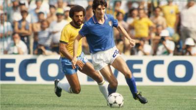 Paolo Rossi of Italy shields the ball from Junior of Brazil