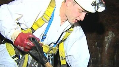 Daniel Brackley from Thames Water digging for fat in London's sewers