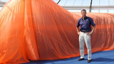 Andy Green stands next to Bloodhound model