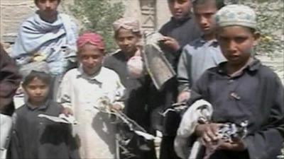 Children hold debris