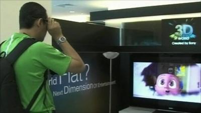 A man watching a 3D TV